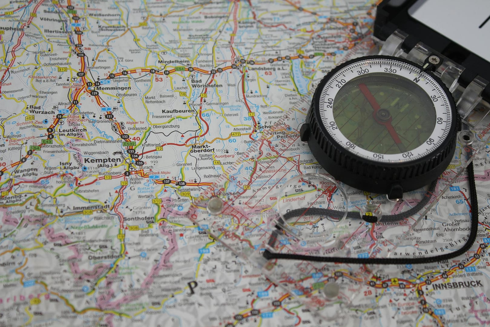 A map of Germany with a traditional compass, highlighting navigation and exploration.