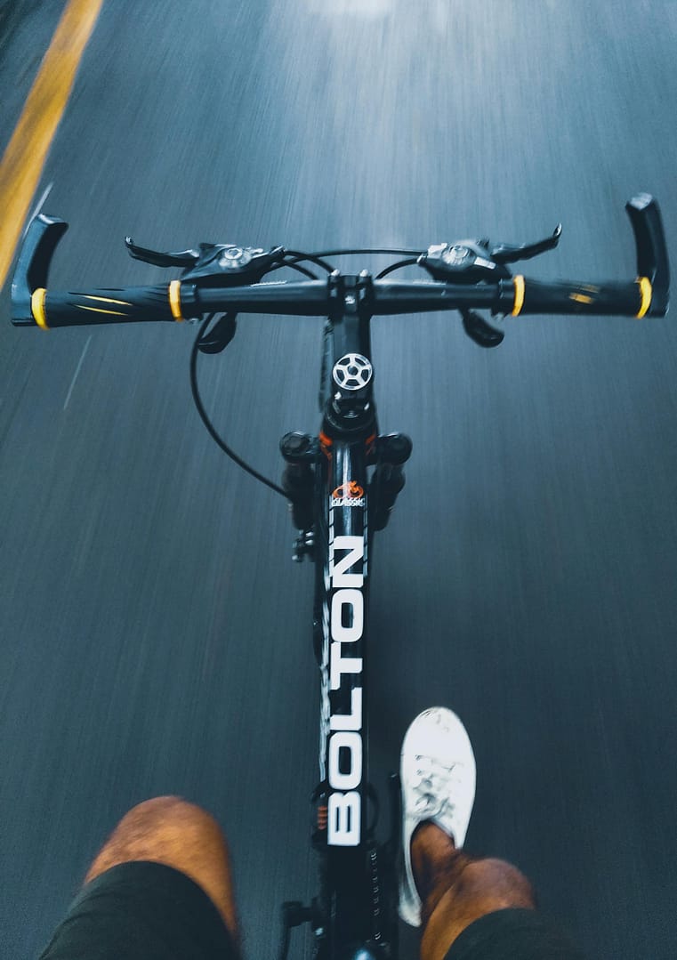 POV shot of a cyclist riding through Pune showing motion and adventure.
